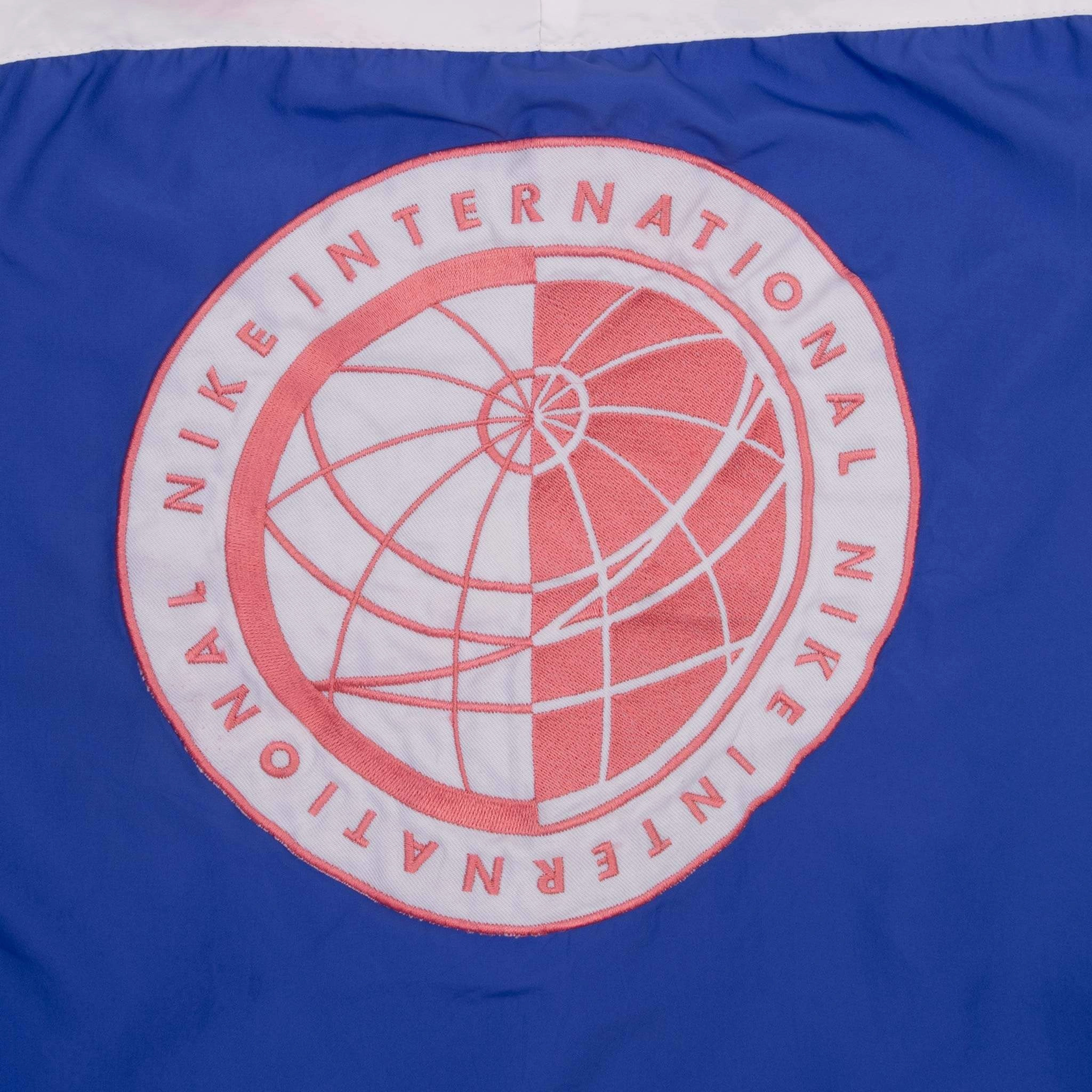 VINTAGE NIKE INTERNATIONAL PURPLE WINDBREAKER JACKET 1990S SIZE MEDIUM