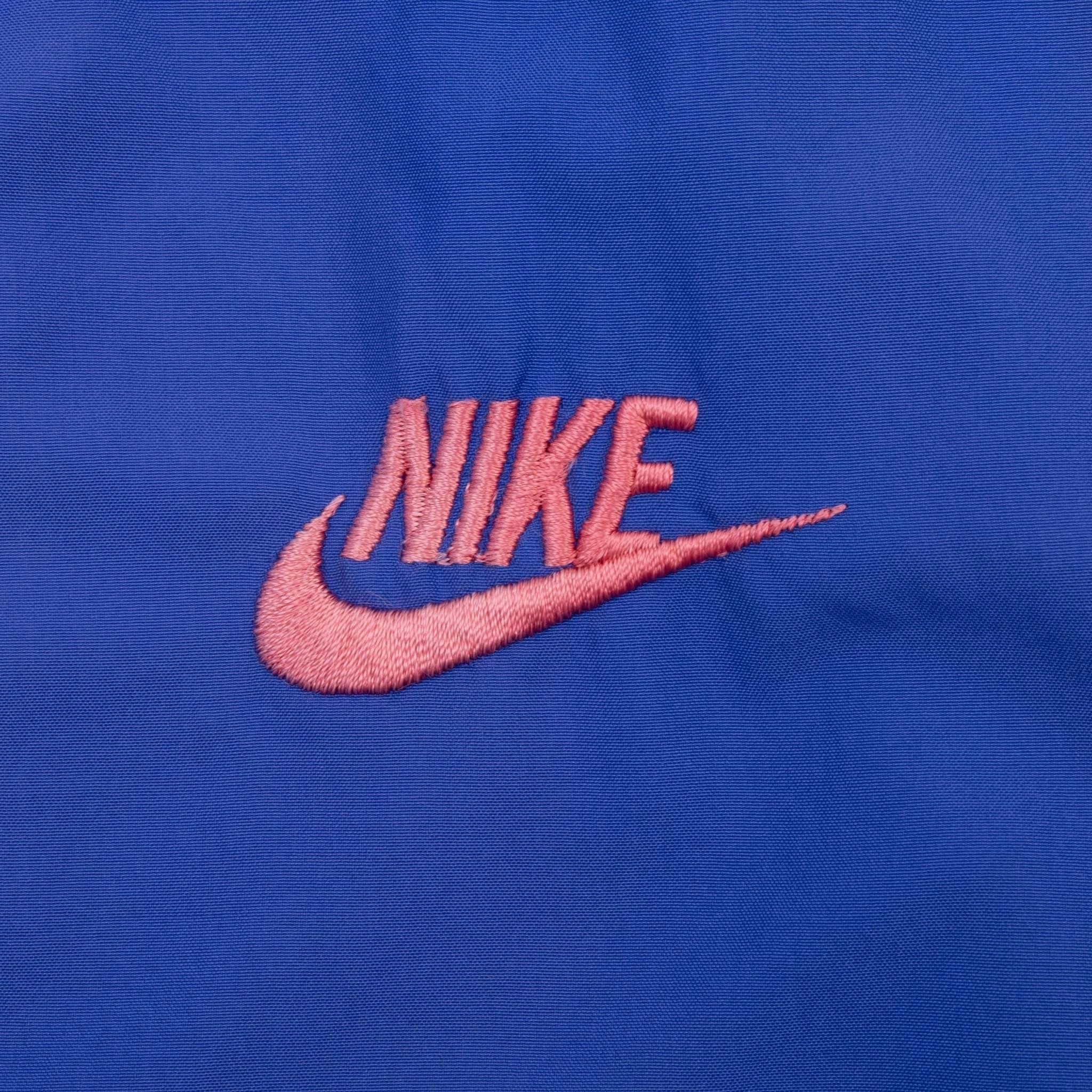 VINTAGE NIKE INTERNATIONAL PURPLE WINDBREAKER JACKET 1990S SIZE MEDIUM